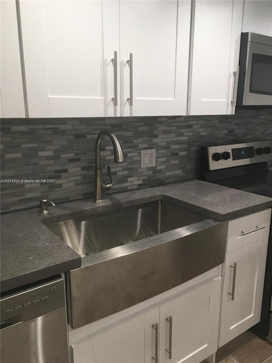 7915 Southwest 86th Street, Unit 723 Miami, FL 33143 - Photo 2 of 14 a close view of sink and tap