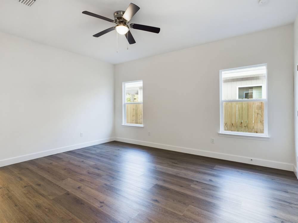 21 D 5th Avenue Shalimar, FL 32579 - Photo 11 of 18 a view of empty room with wooden floor and fan
