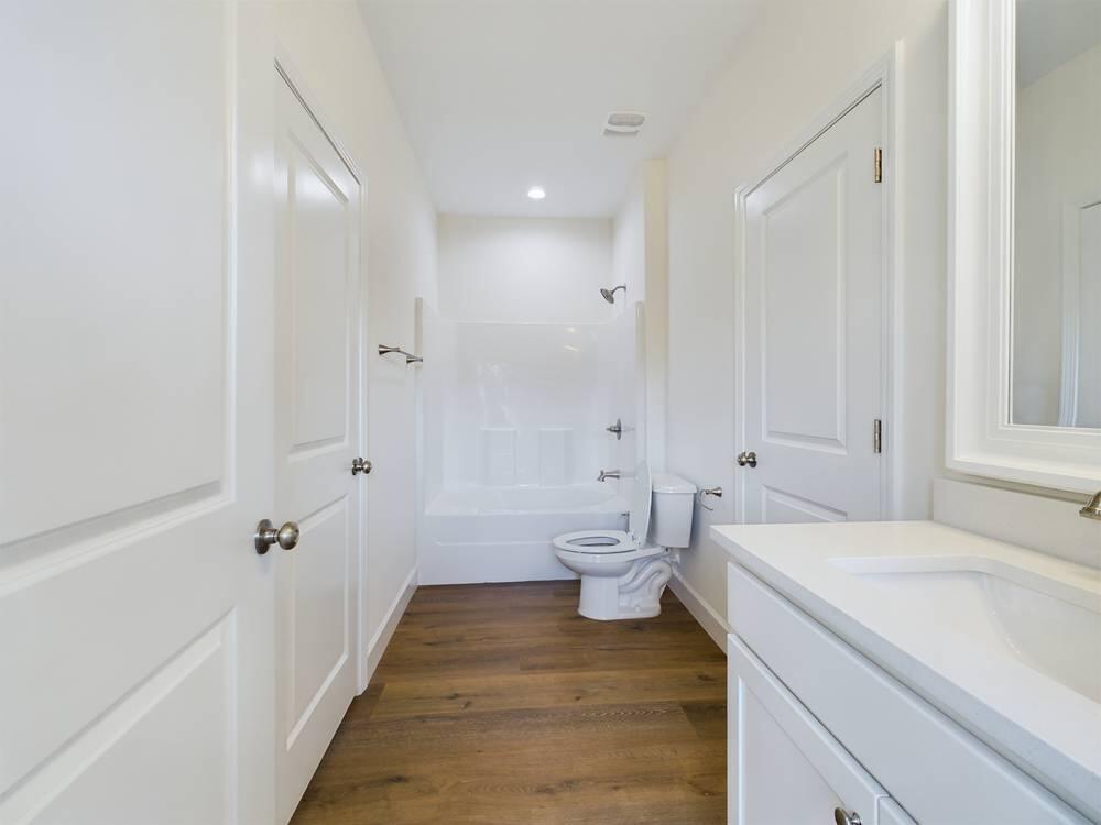 21 D 5th Avenue Shalimar, FL 32579 - Photo 14 of 18 a spacious bathroom with a sink and a toilet