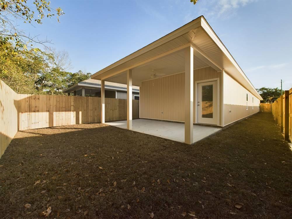 21 D 5th Avenue Shalimar, FL 32579 - Photo 17 of 18 a view of a house with a yard