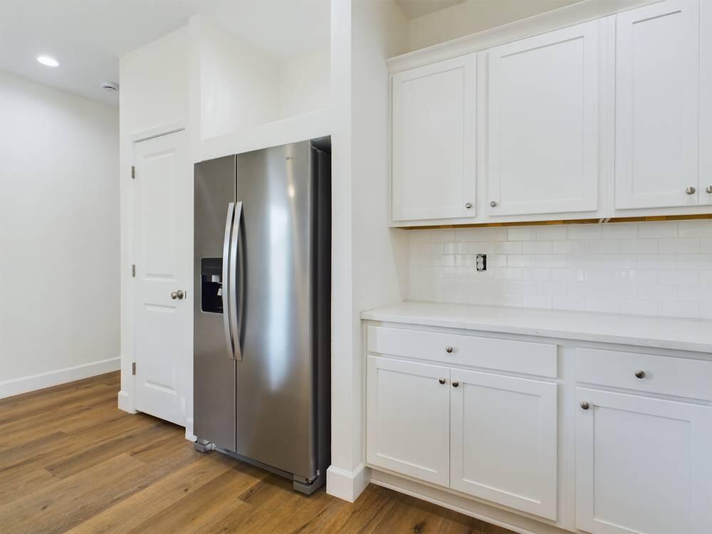 21 D 5th Avenue Shalimar, FL 32579 - Photo 10 of 18 a view of cabinets and wooden floor