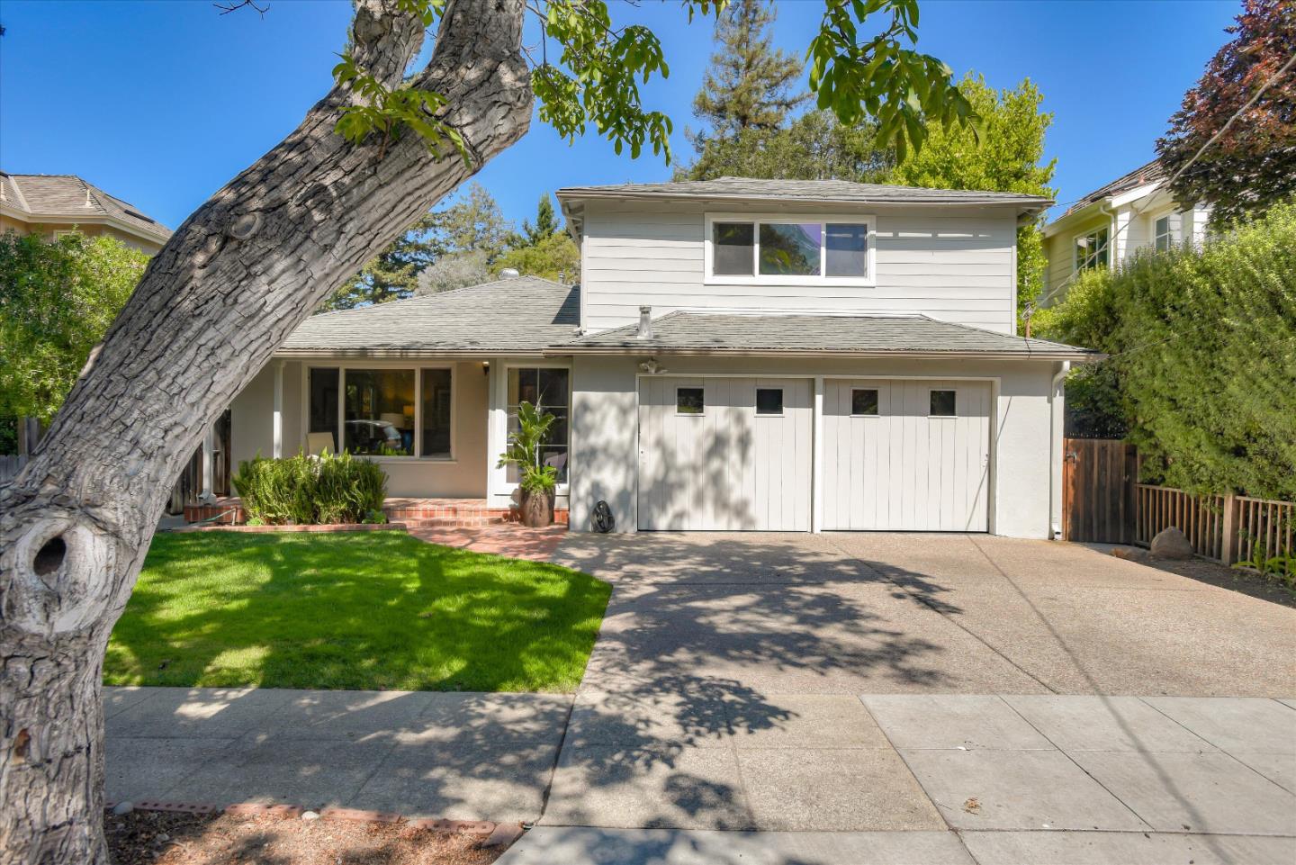 340 Princeton Road Menlo Park, CA 94025 - Photo 2 of 31 a front view of a house with a yard and potted plants