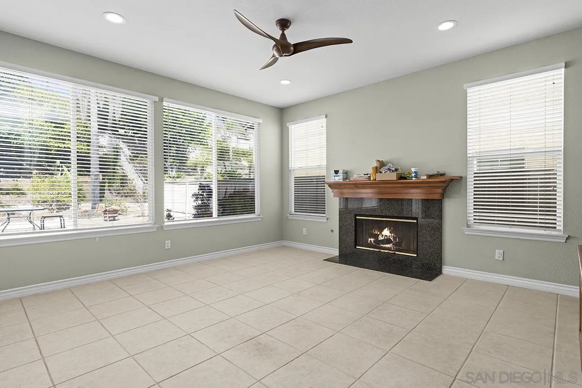 4418 Shorepointe Way San Diego, CA 92130 - Photo 26 of 65 a living room with furniture and a fireplace