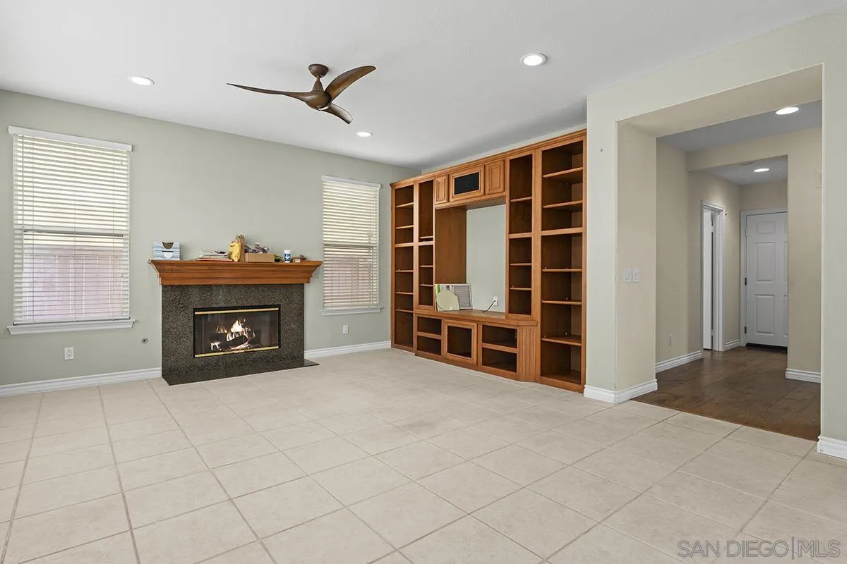 4418 Shorepointe Way San Diego, CA 92130 - Photo 27 of 65 a view of livingroom with furniture and a fireplace