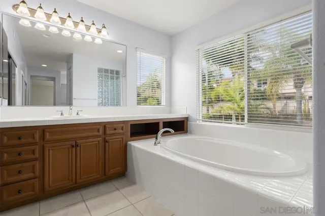 a bathroom with a bathtub and window