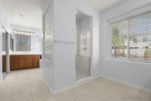 a white toilet sitting next to a bath tub