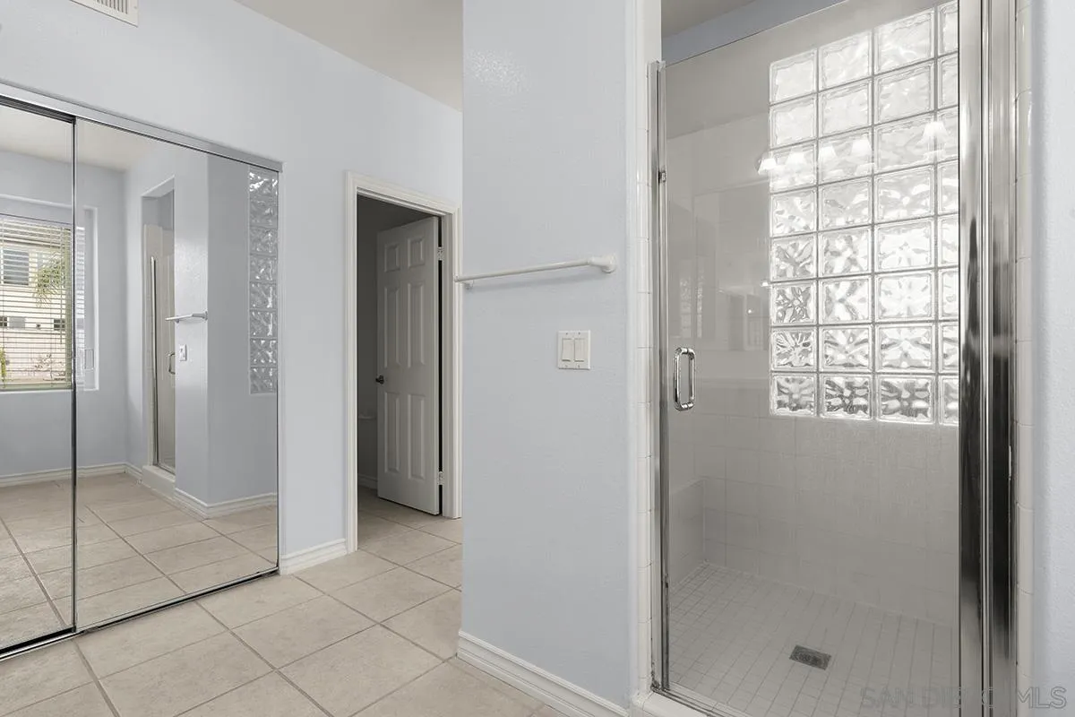 4418 Shorepointe Way San Diego, CA 92130 - Photo 43 of 65 a bathroom with a shower