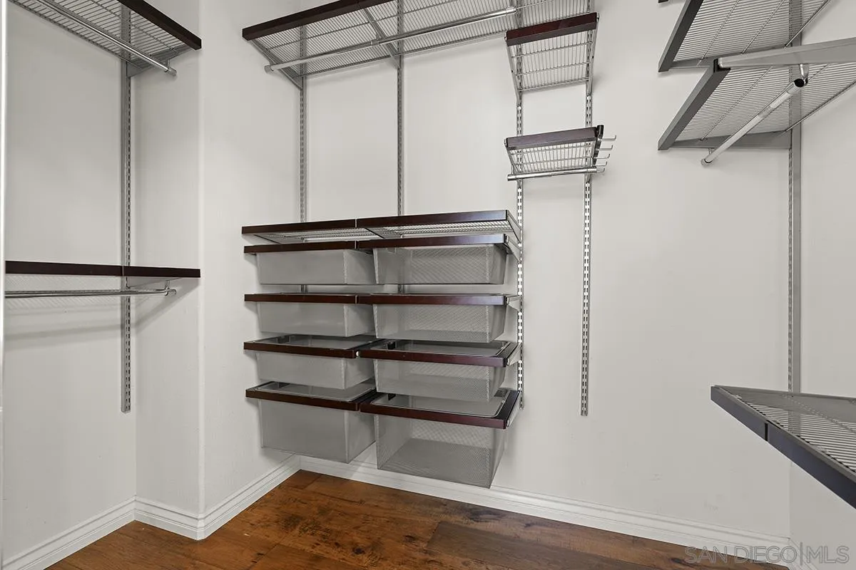 4418 Shorepointe Way San Diego, CA 92130 - Photo 45 of 65 a view of walk in closet with empty racks