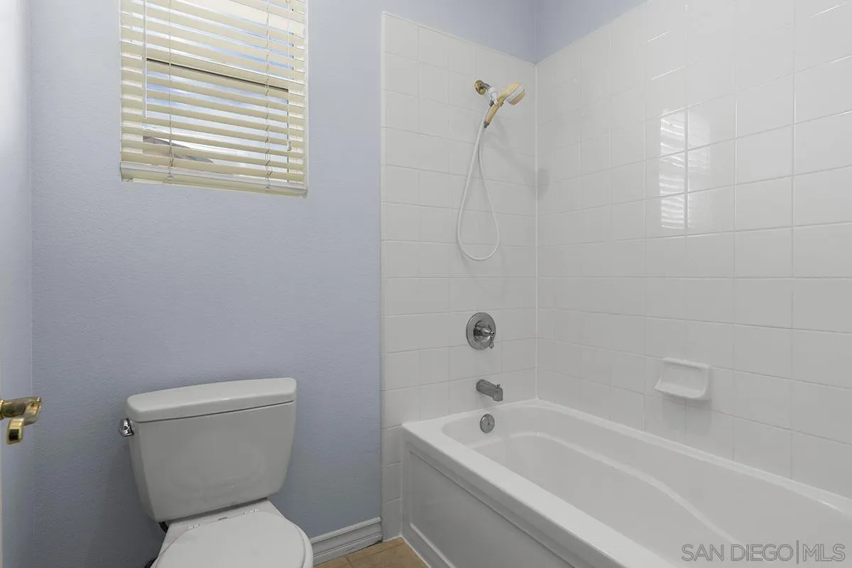 4418 Shorepointe Way San Diego, CA 92130 - Photo 49 of 65 a white toilet sitting next to a bath tub