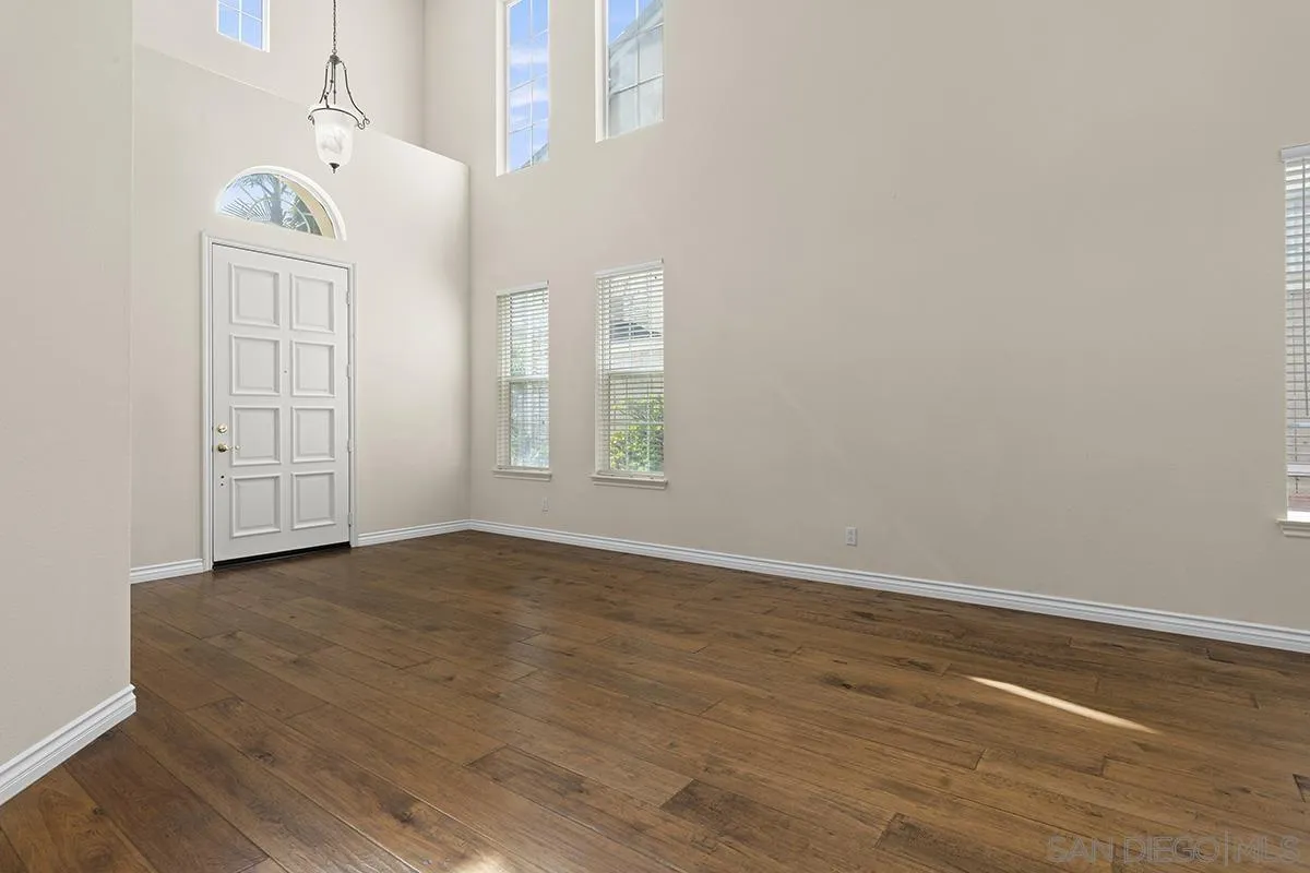 4418 Shorepointe Way San Diego, CA 92130 - Photo 7 of 65 an empty room with windows