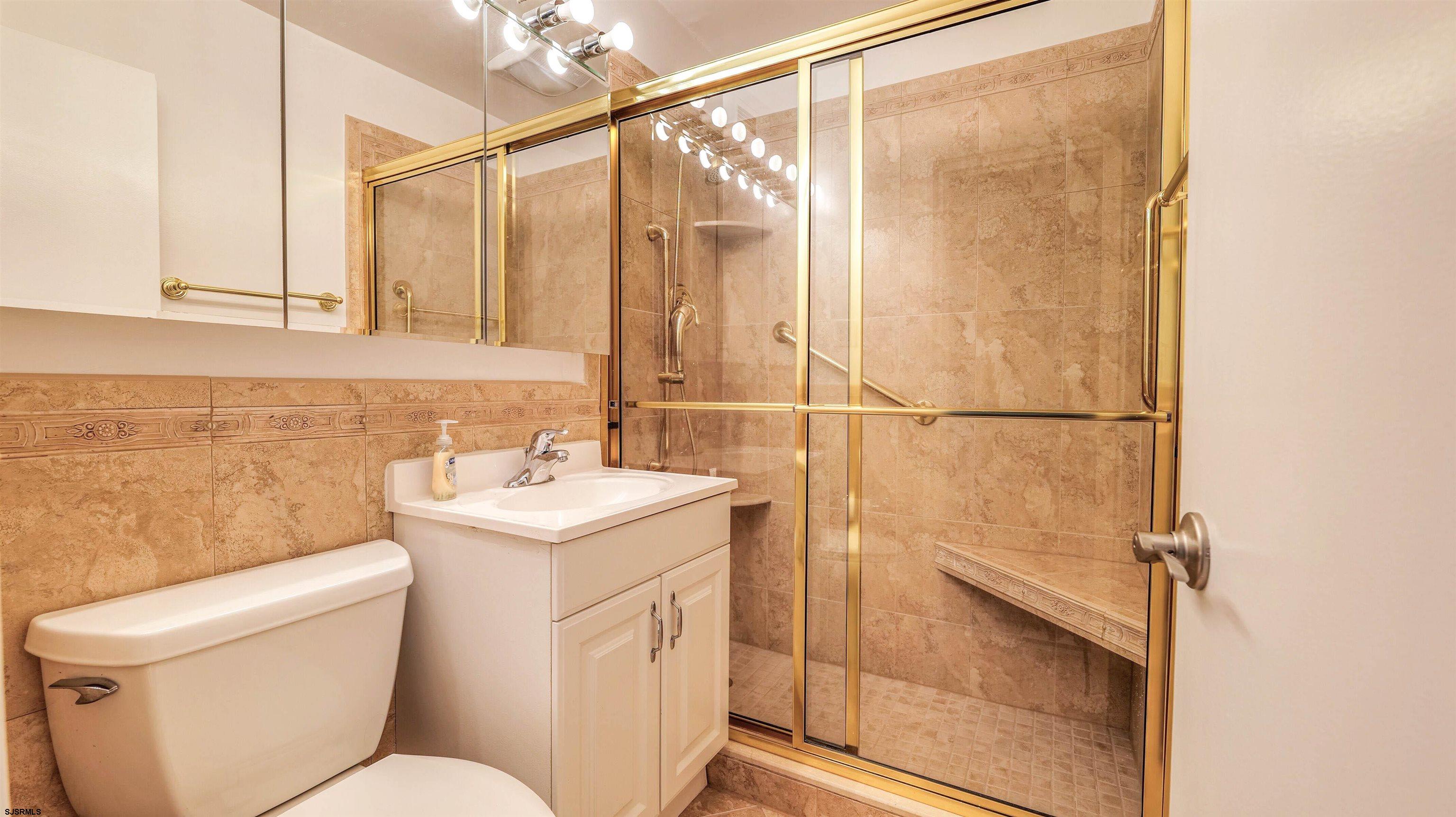101 South Raleigh Avenue, Unit 226 Atlantic City, NJ 08401 - Photo 14 of 26 a bathroom with a sink a toilet and shower