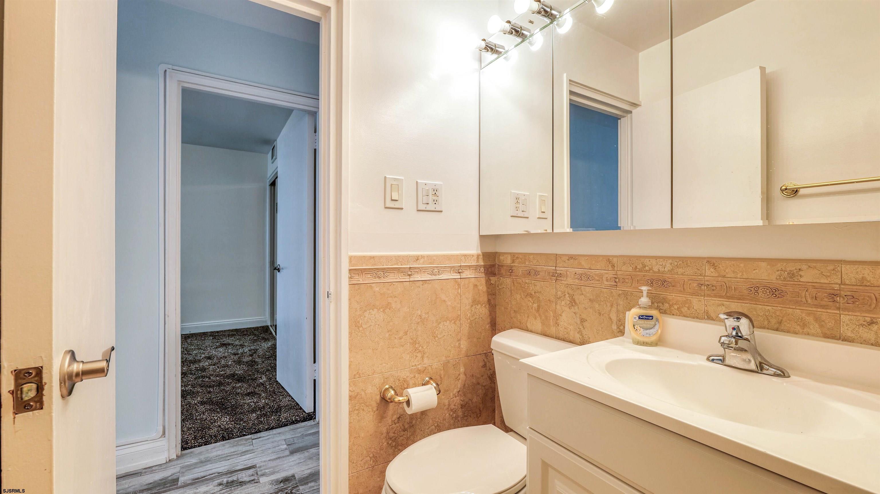 101 South Raleigh Avenue, Unit 226 Atlantic City, NJ 08401 - Photo 16 of 26 a bathroom with a sink toilet and shower