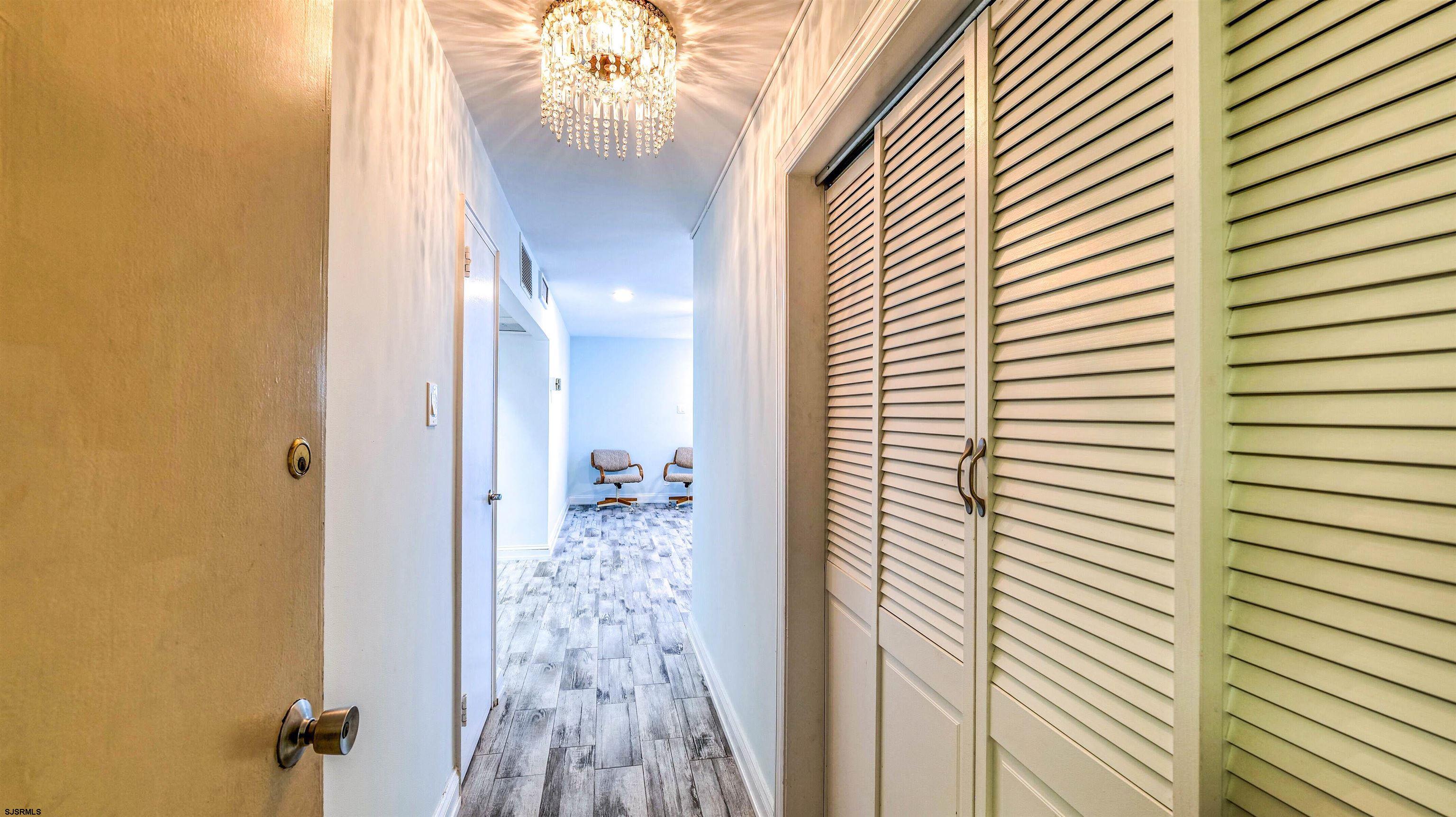 101 South Raleigh Avenue, Unit 226 Atlantic City, NJ 08401 - Photo 6 of 26 a bathroom with a sink and a mirror