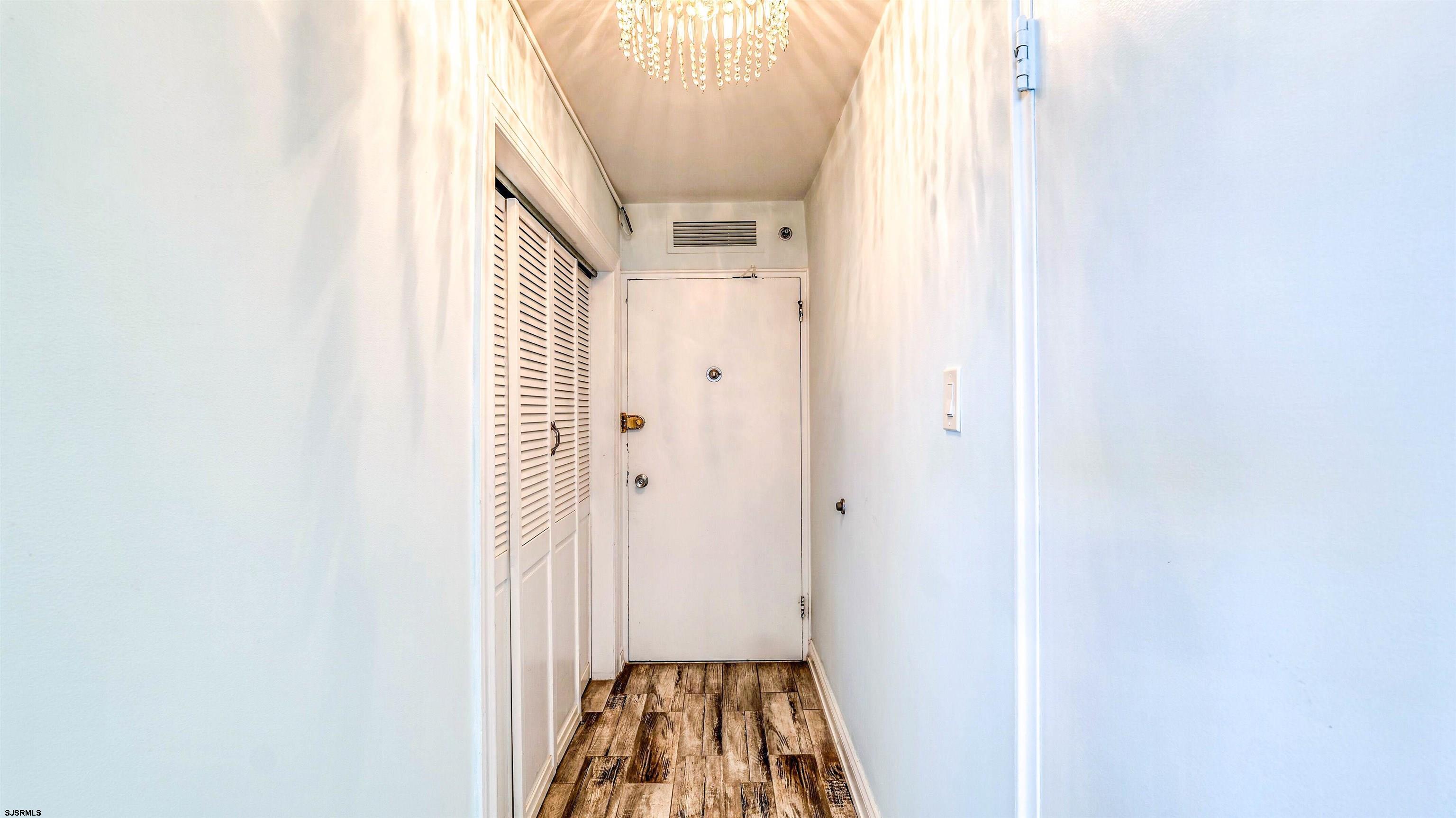 101 South Raleigh Avenue, Unit 226 Atlantic City, NJ 08401 - Photo 7 of 26 a view of a hallway with wooden floor and entryway