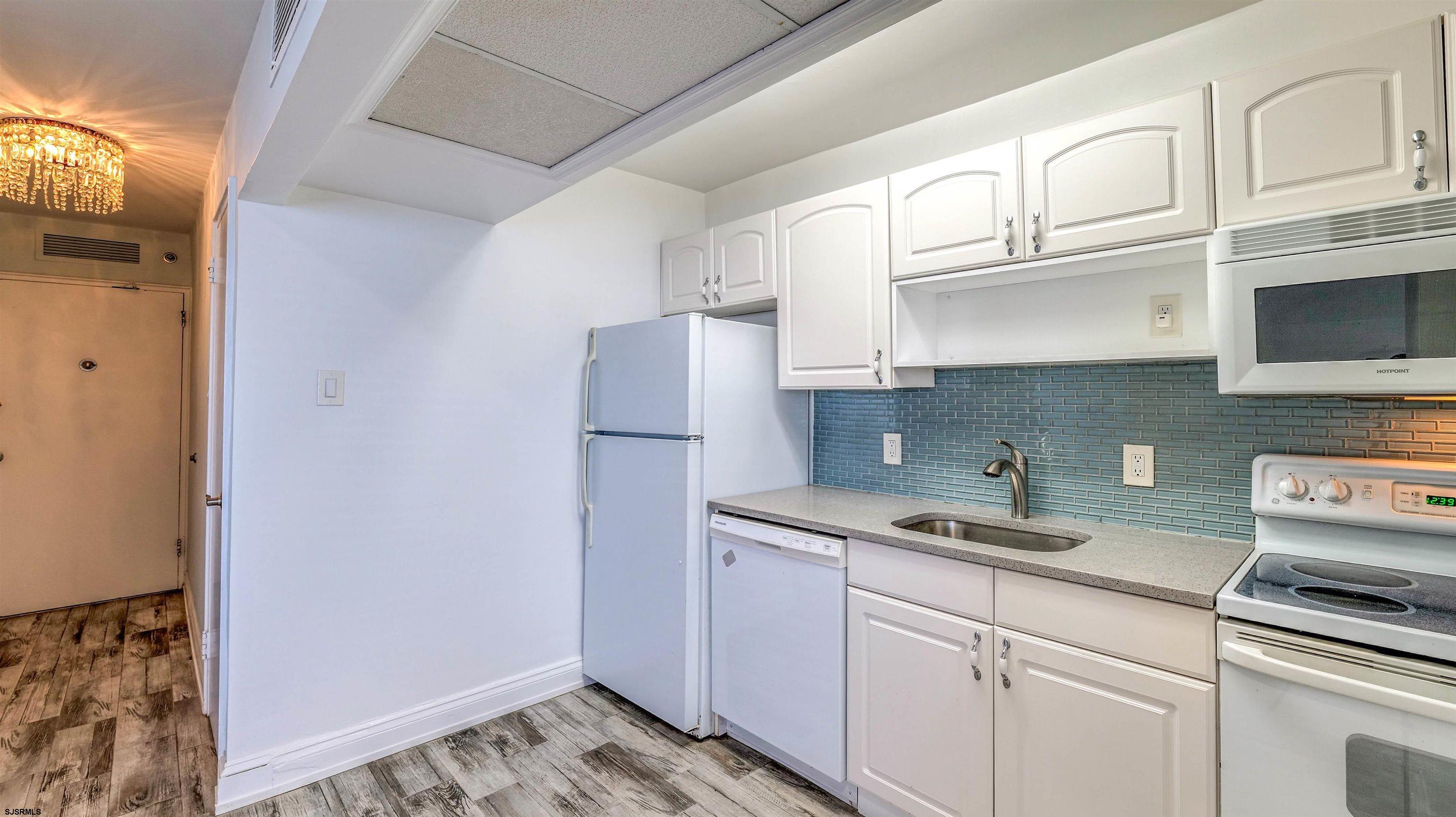 101 South Raleigh Avenue, Unit 226 Atlantic City, NJ 08401 - Photo 10 of 26 a kitchen with cabinets stainless steel appliances and a counter space