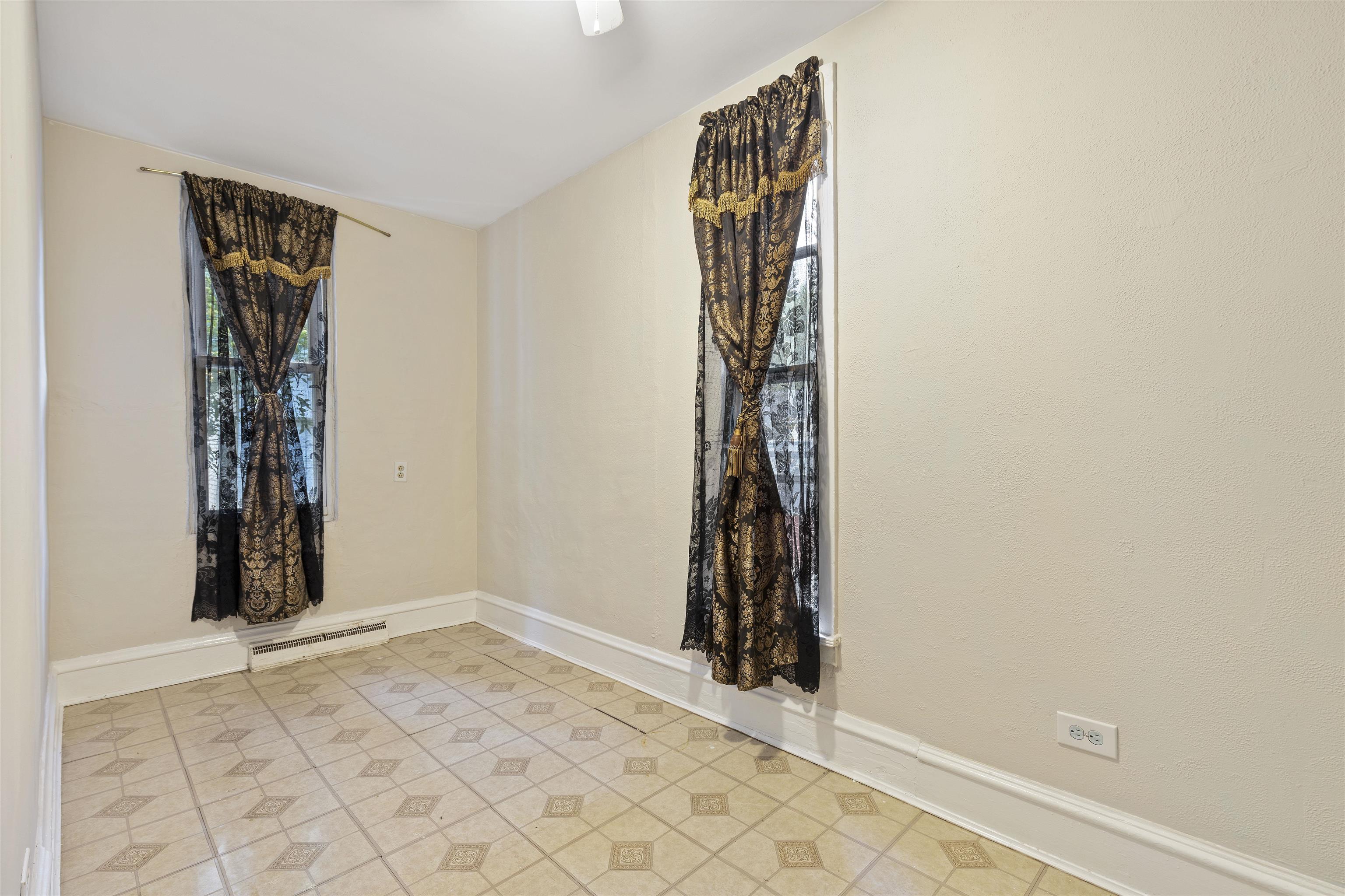 638 Grace Street Elgin, IL 60120 - Photo 12 of 12 an empty room with windows and closet