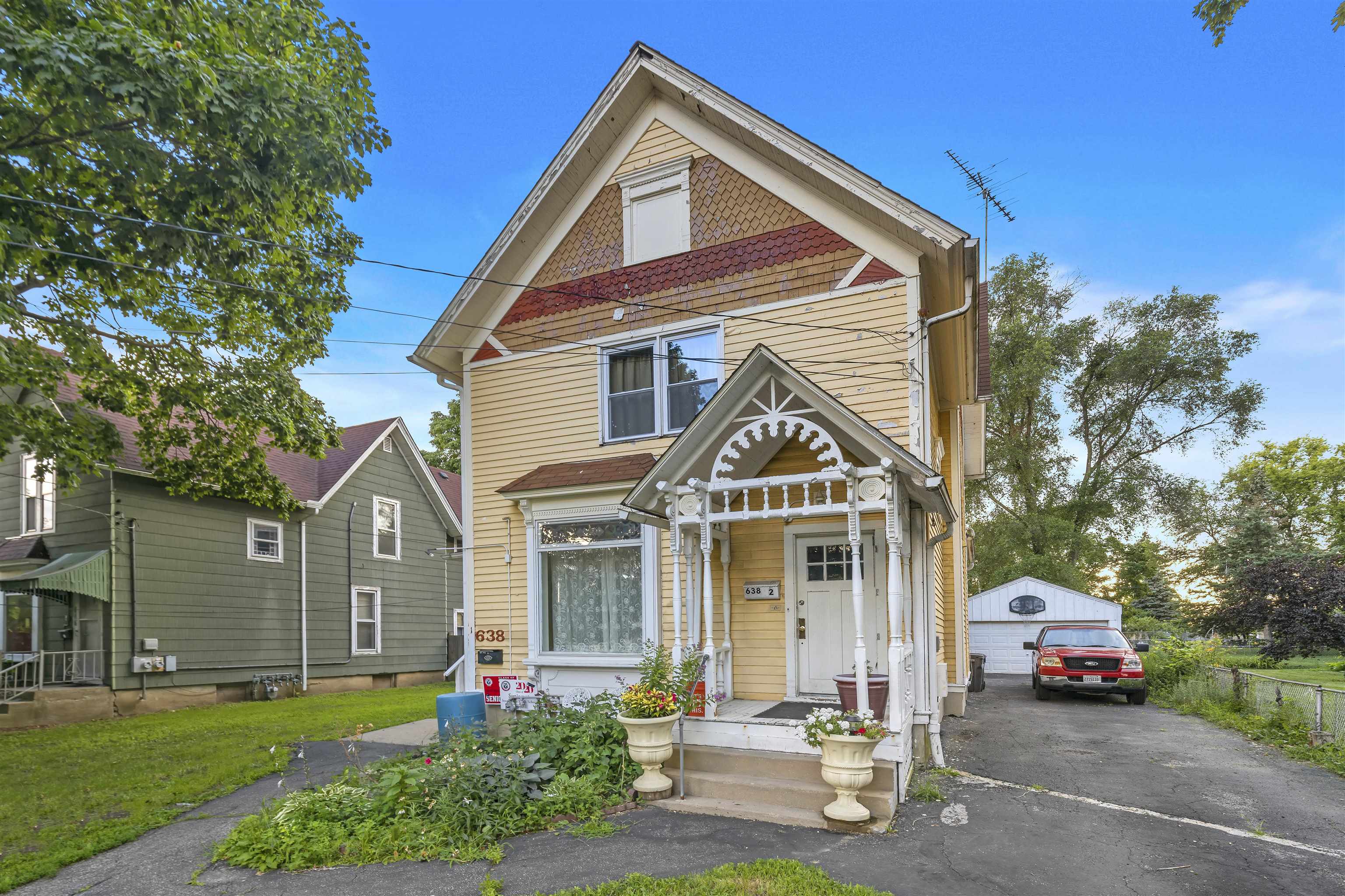 638 Grace Street Elgin, IL 60120 - Photo 2 of 12 a front view of a house with a yard