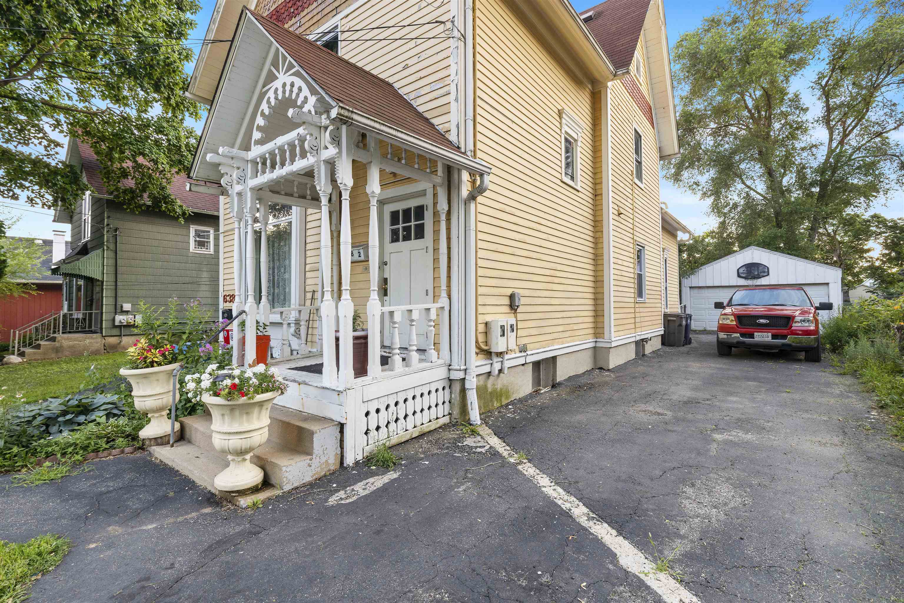 638 Grace Street Elgin, IL 60120 - Photo 3 of 12 a view of a house with a yard and sitting area
