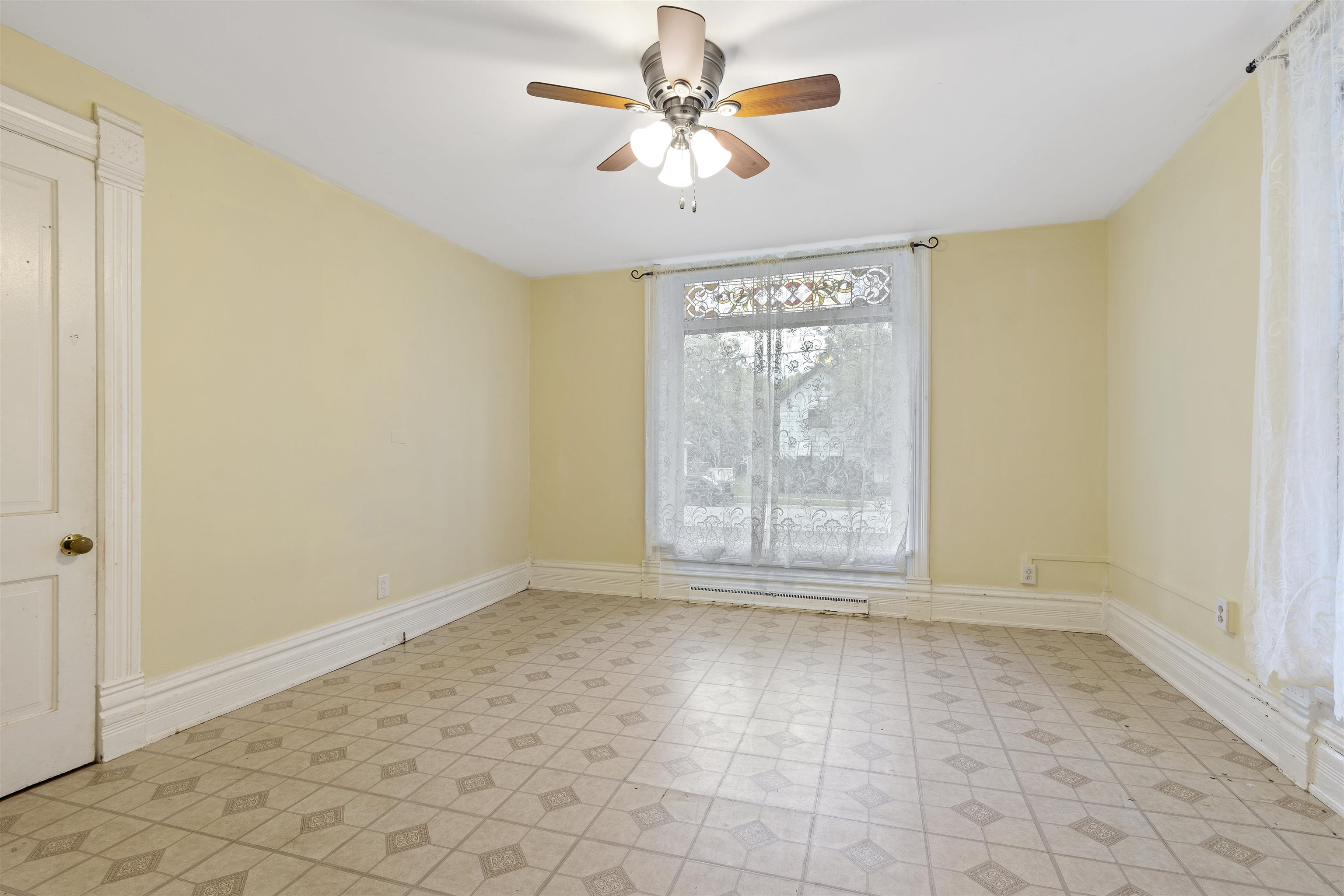 638 Grace Street Elgin, IL 60120 - Photo 8 of 12 a view of an empty room with a window