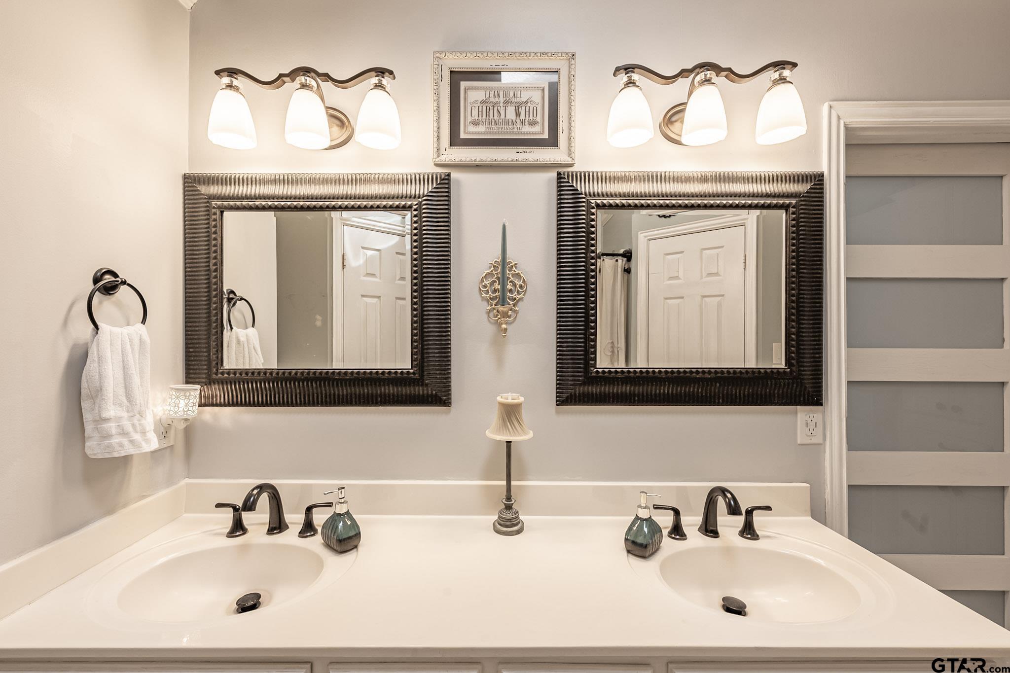 703 Kickapoo Road Chandler, TX 75758 - Photo 13 of 33 a bathroom with a sink and a mirror