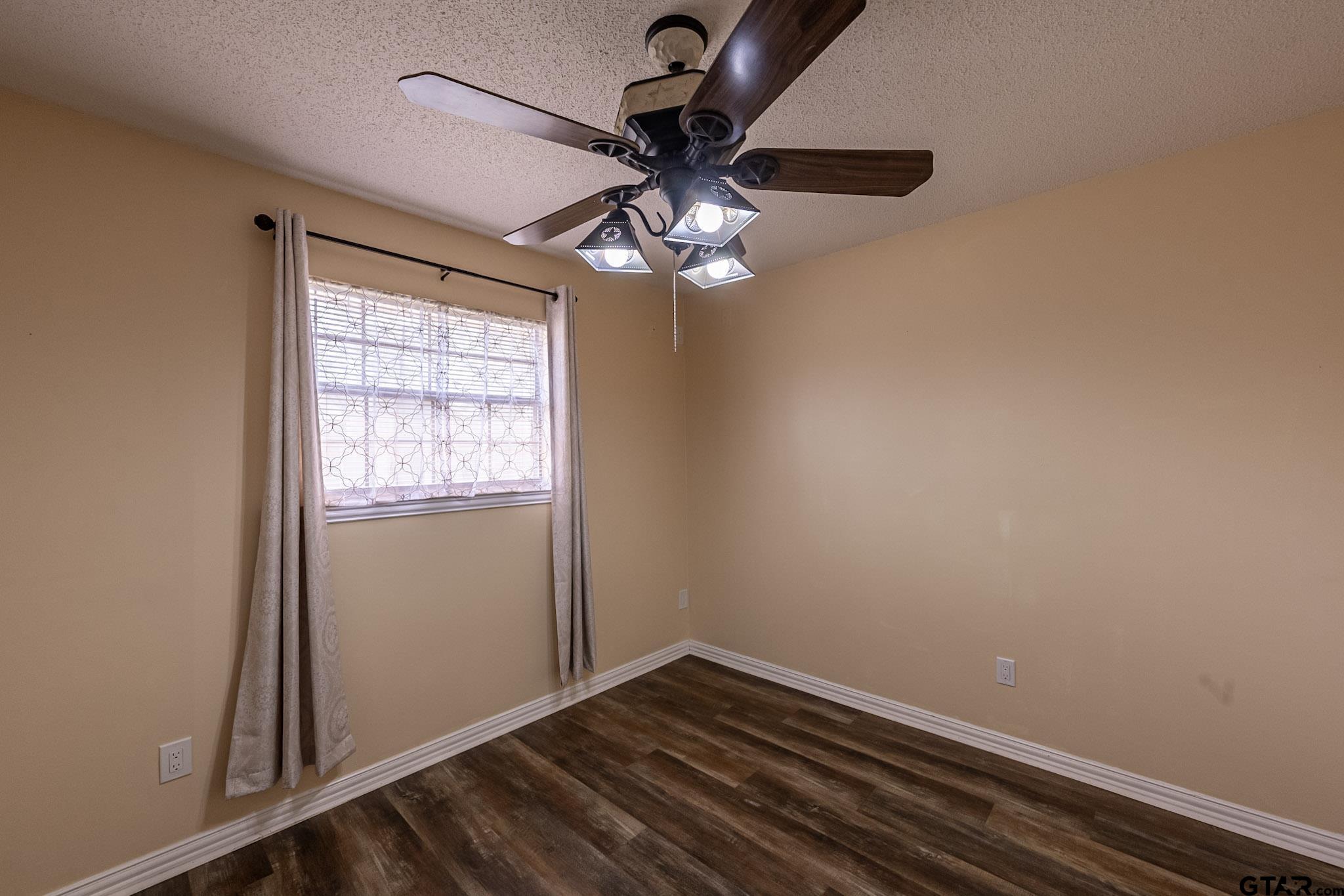 703 Kickapoo Road Chandler, TX 75758 - Photo 20 of 33 a view of room with window and ceiling fan