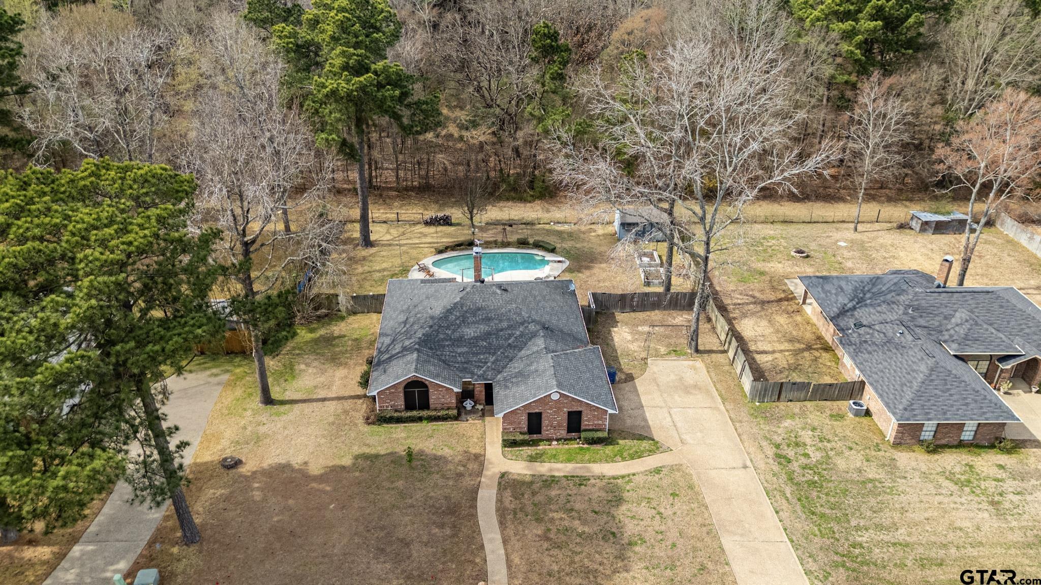 703 Kickapoo Road Chandler, TX 75758 - Photo 30 of 33 a view of a swimming pool with a patio