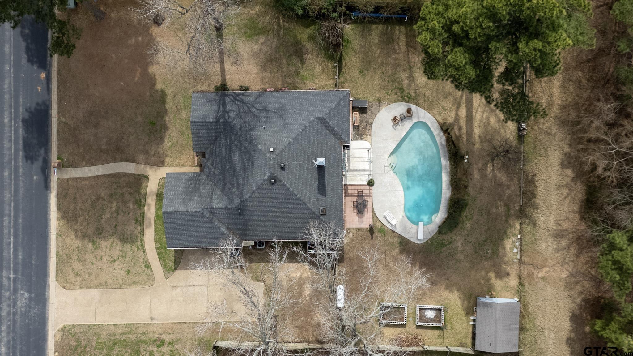 703 Kickapoo Road Chandler, TX 75758 - Photo 32 of 33 an aerial view of a house with outdoor space and a lake view