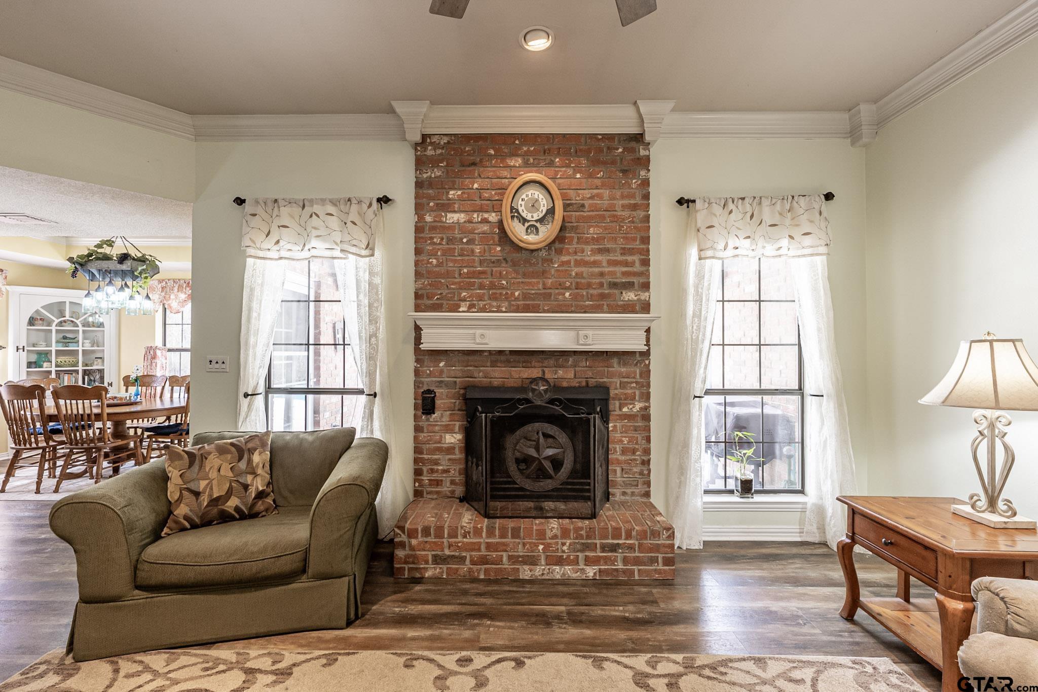 703 Kickapoo Road Chandler, TX 75758 - Photo 4 of 33 a living room with furniture and a fireplace