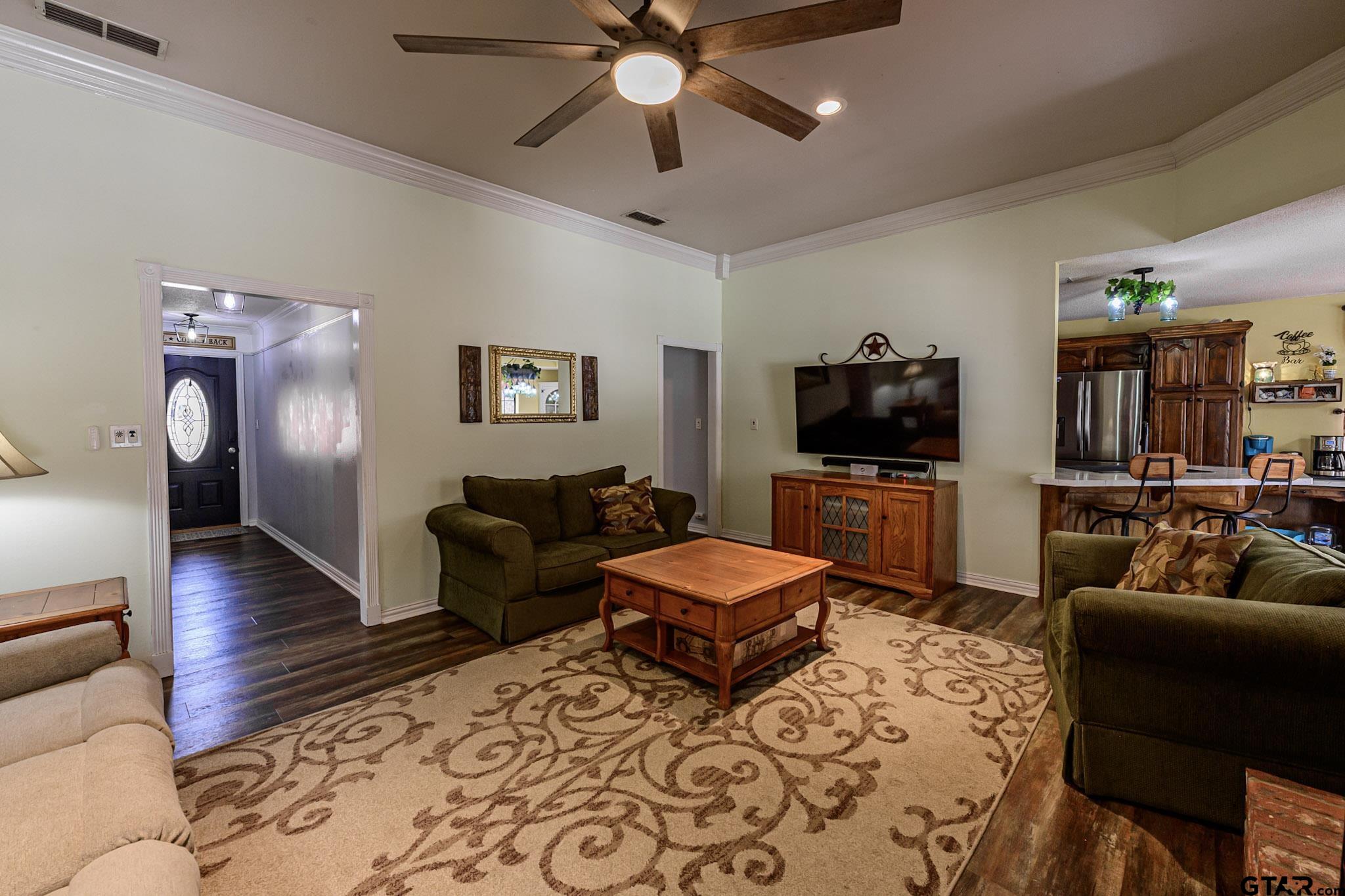 703 Kickapoo Road Chandler, TX 75758 - Photo 5 of 33 a living room with furniture and a flat screen tv