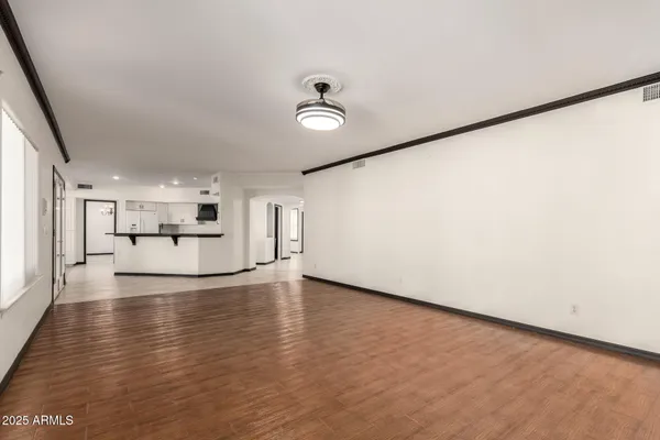 a kitchen with stainless steel appliances a stove a sink a microwave and a refrigerator