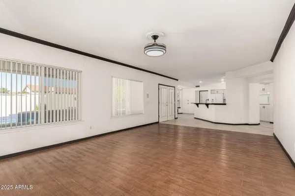 a kitchen with stainless steel appliances a stove a sink a microwave and a refrigerator