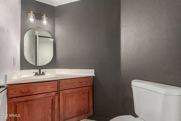a spacious bathroom with a double vanity sink and a mirror