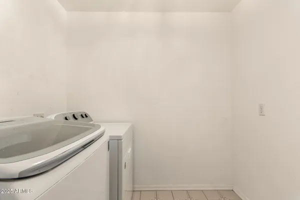 a view of a livingroom with furniture and a flat screen tv