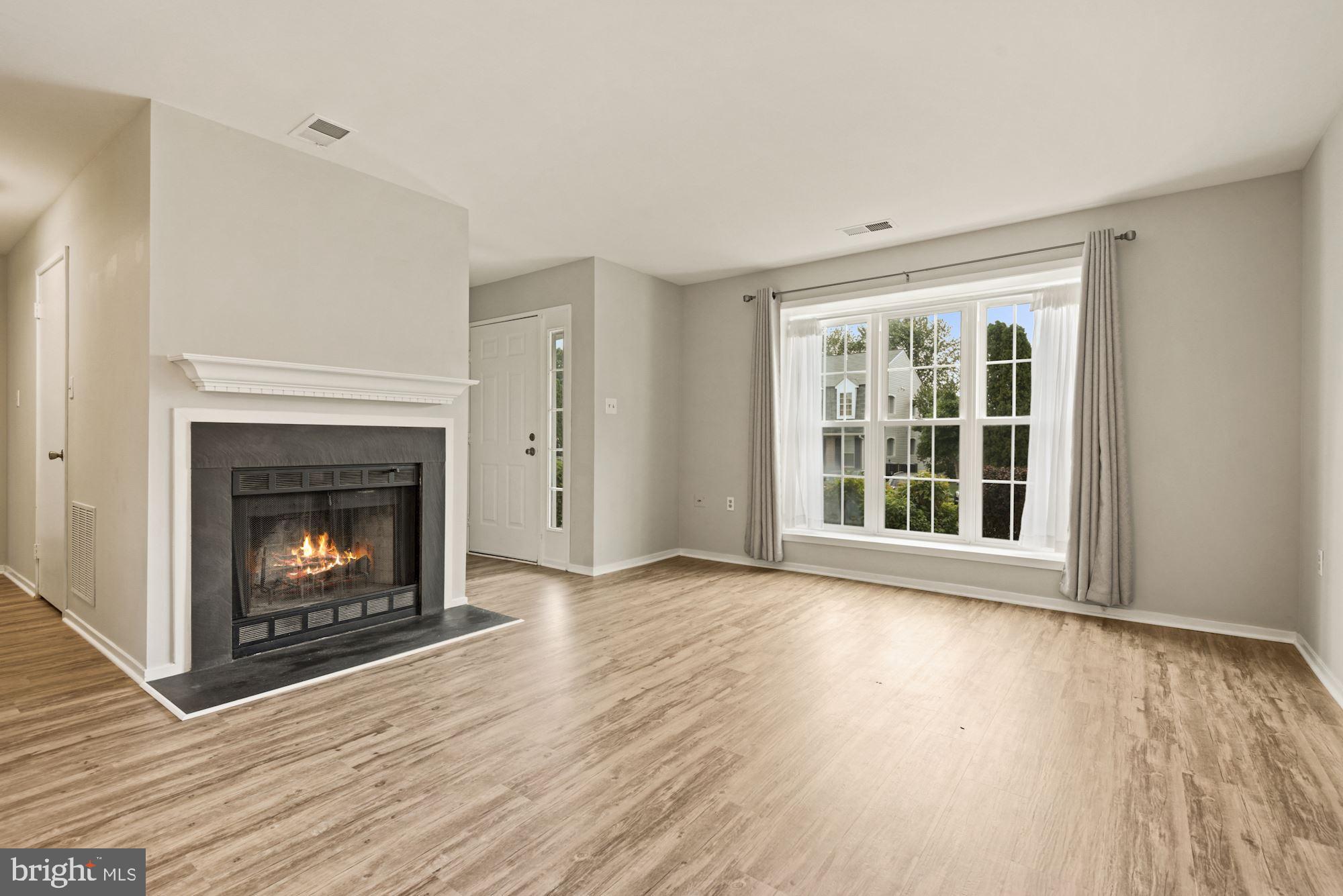 7825 Harrowgate Circle, Unit 142 Springfield, VA 22152 - Photo 11 of 38 Living Room w/Fireplace