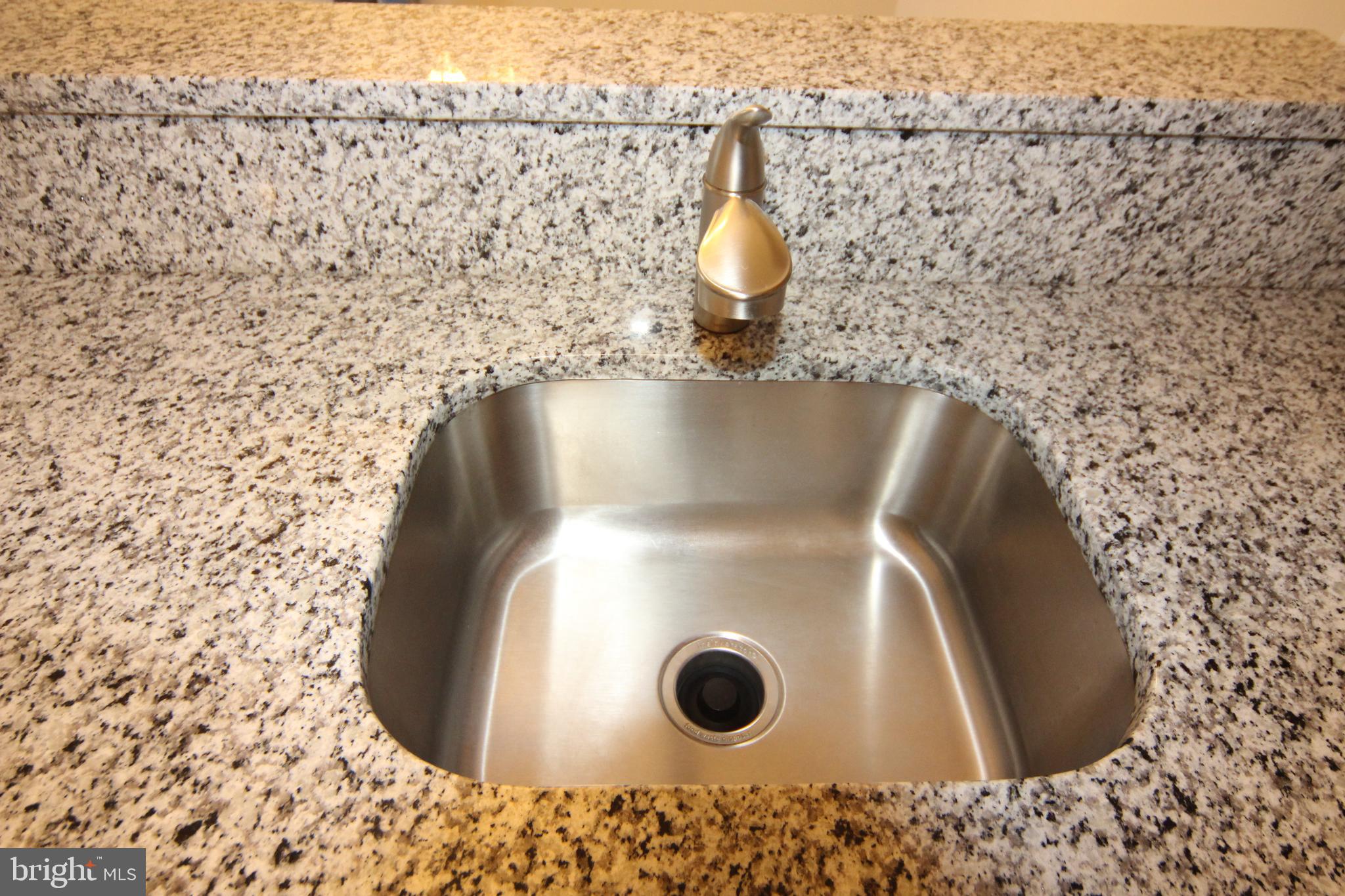 7825 Harrowgate Circle, Unit 142 Springfield, VA 22152 - Photo 17 of 38 Granite Counters and Pull out Faucet