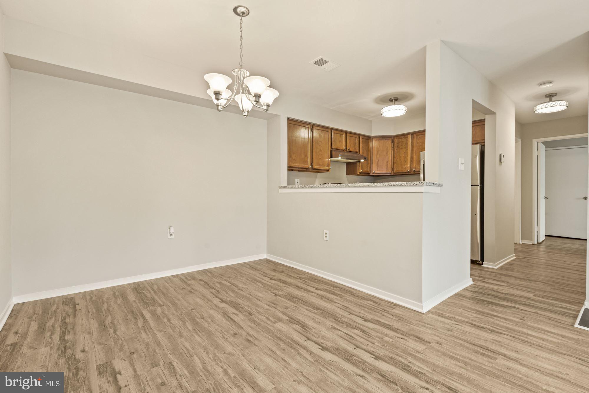 7825 Harrowgate Circle, Unit 142 Springfield, VA 22152 - Photo 21 of 38 Dining Area adjoins Kitchen