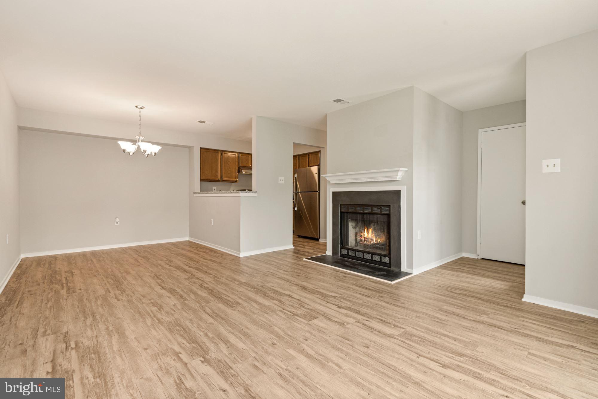 7825 Harrowgate Circle, Unit 142 Springfield, VA 22152 - Photo 10 of 38 Overview Living Room into Dining Room