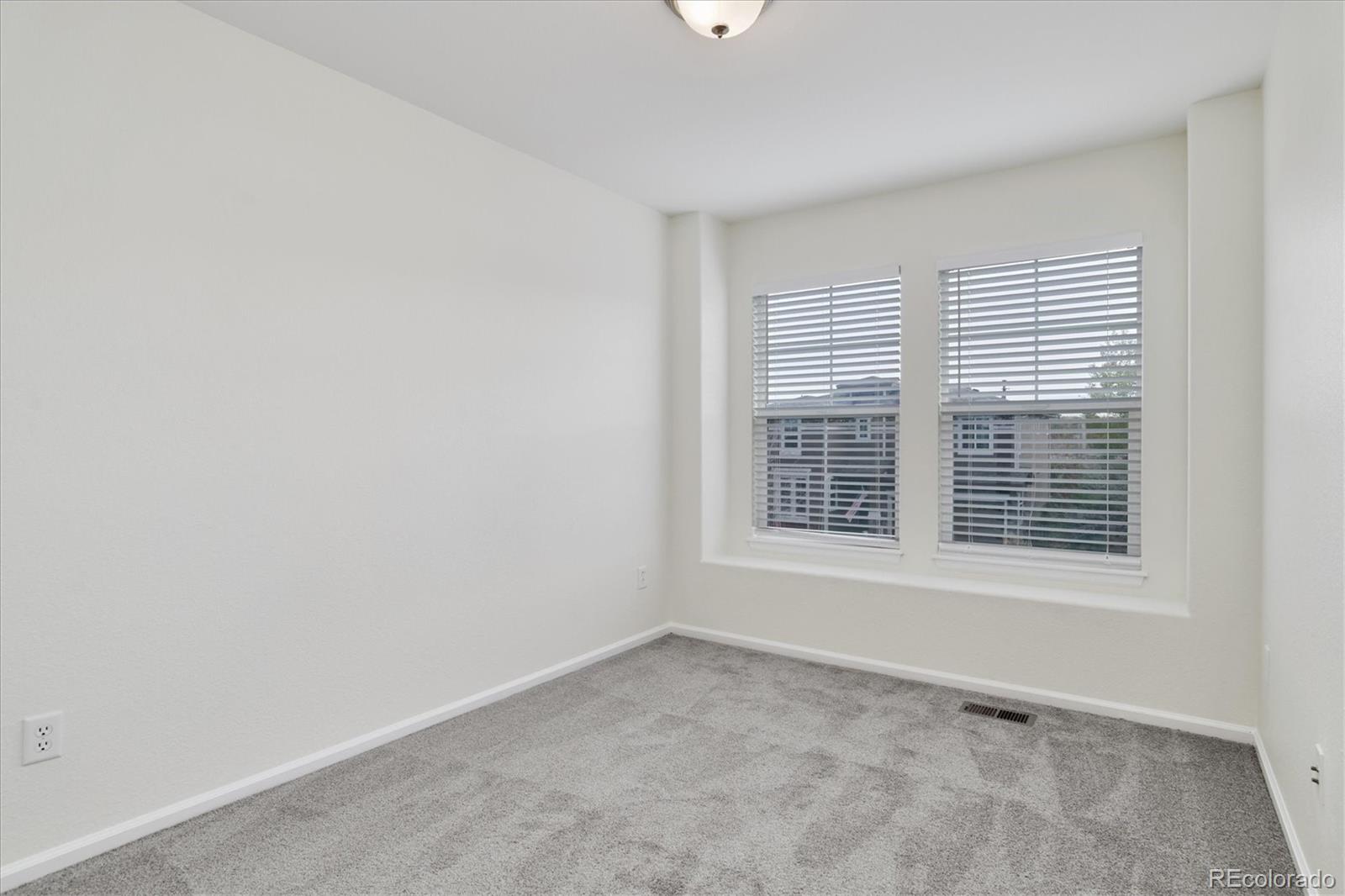 10781 Towerbridge Circle Highlands Ranch, CO 80130 - Photo 24 of 30 a view of an empty room with a window