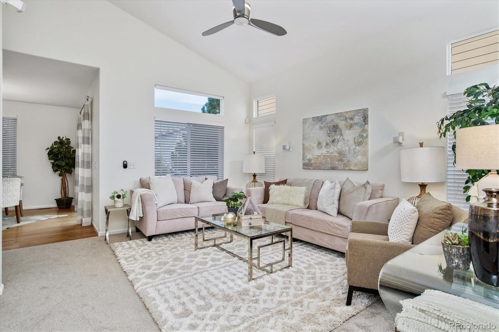 10781 Towerbridge Circle Highlands Ranch, CO 80130 - Photo 3 of 30 a living room with furniture and a large window