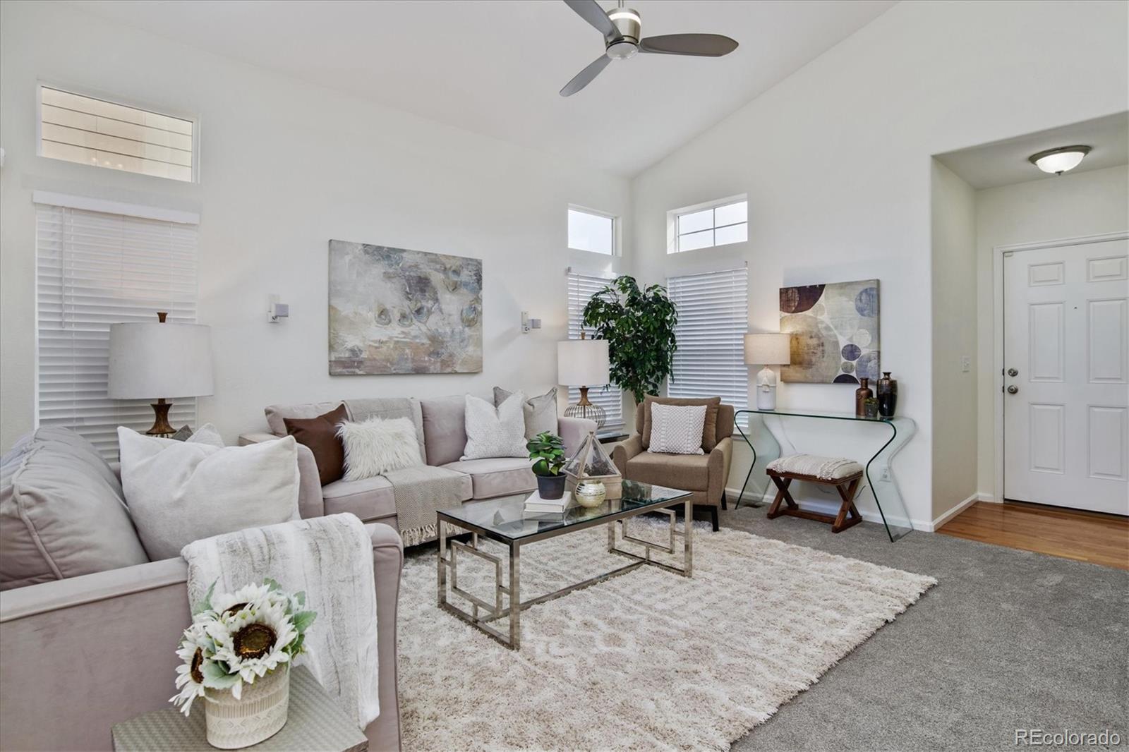10781 Towerbridge Circle Highlands Ranch, CO 80130 - Photo 6 of 30 a living room with furniture and a rug
