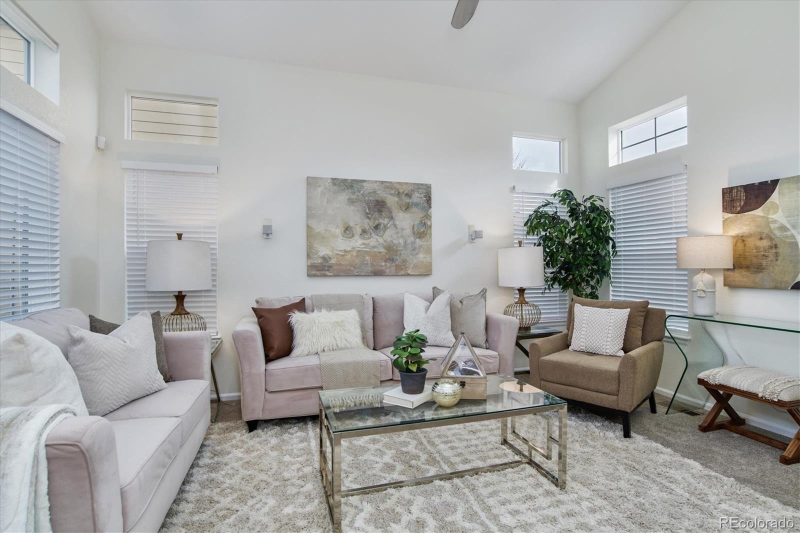 10781 Towerbridge Circle Highlands Ranch, CO 80130 - Photo 7 of 30 a living room with furniture and wooden floor