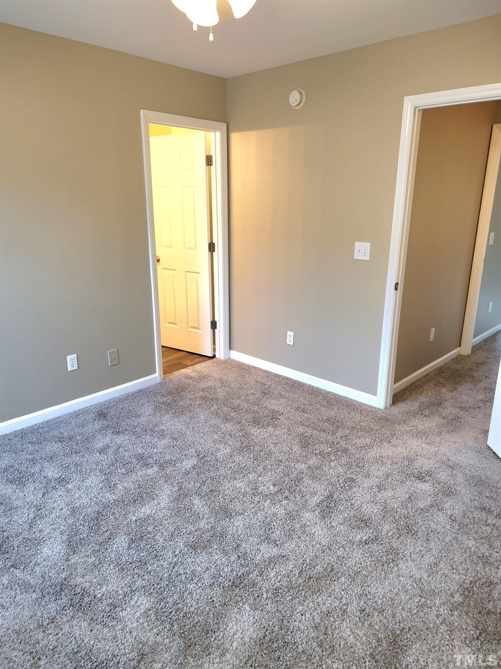 209 Dairy Road Clayton, NC 27520 - Photo 25 of 34 a view of an empty room with a window