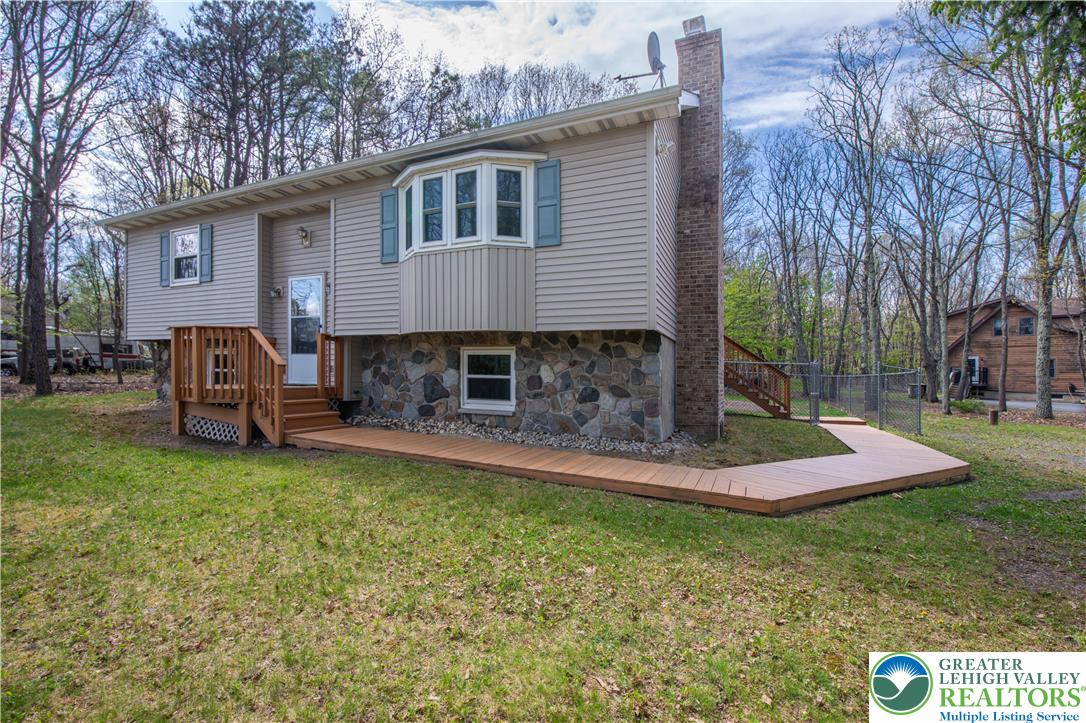 107 Shenkel Road Effort, PA 18330 - Photo 2 of 44 a front view of a house with a garden