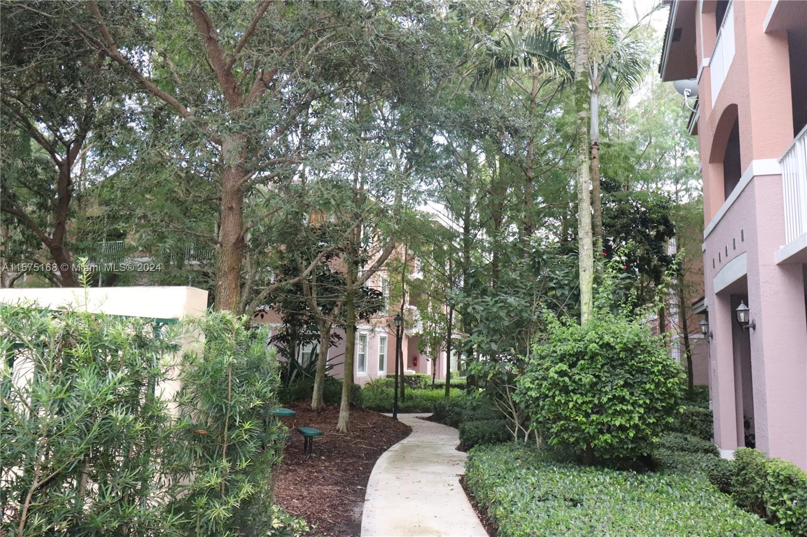 6894 West Sample Road, Unit 6894 Coral Springs, FL 33067 - Photo 3 of 18 a view of a house with a yard