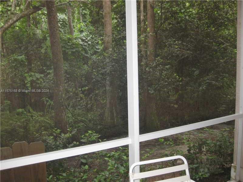 6894 West Sample Road, Unit 6894 Coral Springs, FL 33067 - Photo 4 of 18 a view of a glass door with a glass door