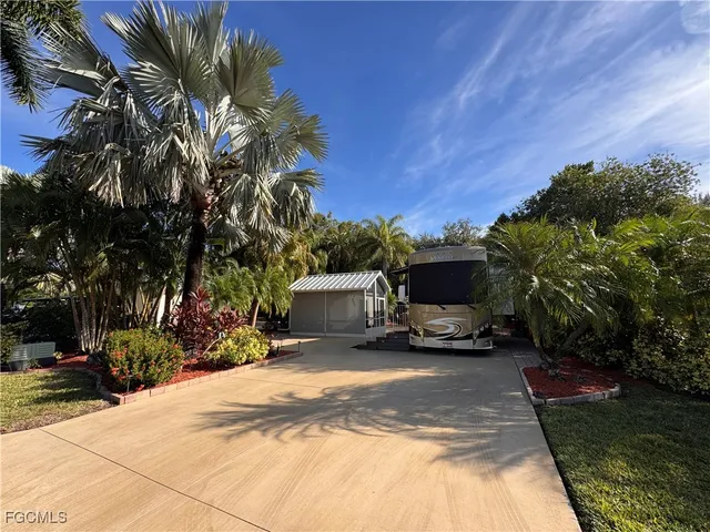 a view of a backyard with a car parked in it