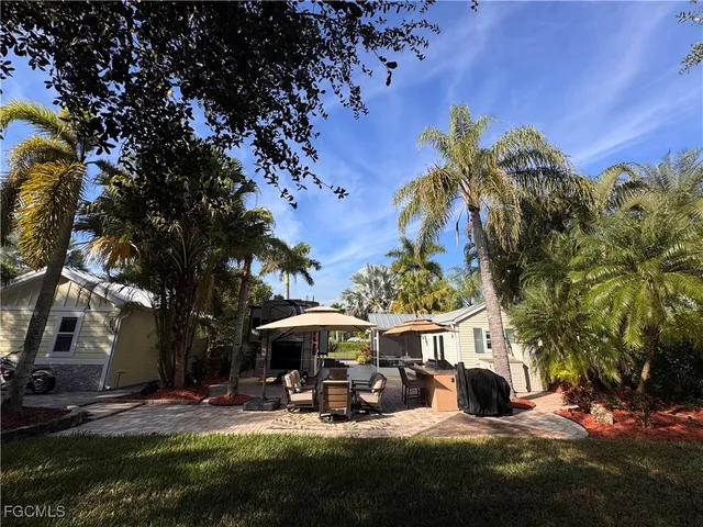 a view of a park with large trees