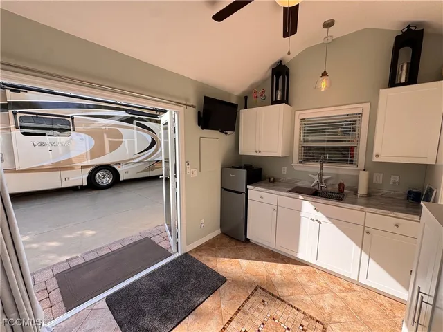 a living room with furniture a rug and a window