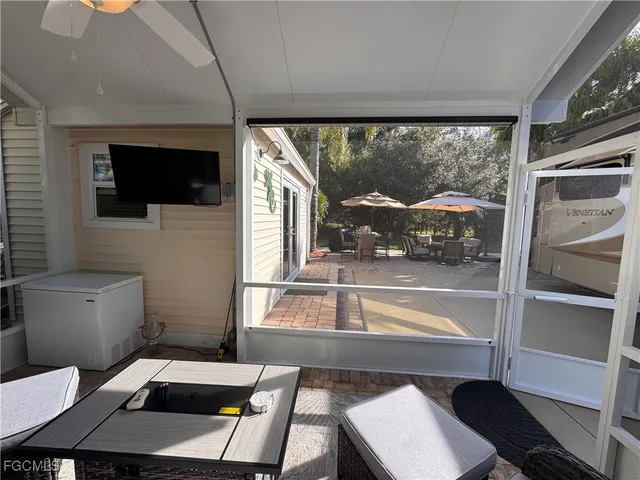 a view of a yard with plants and trees