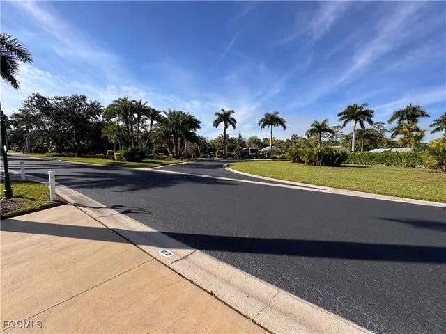 a view of a swimming pool with a yard